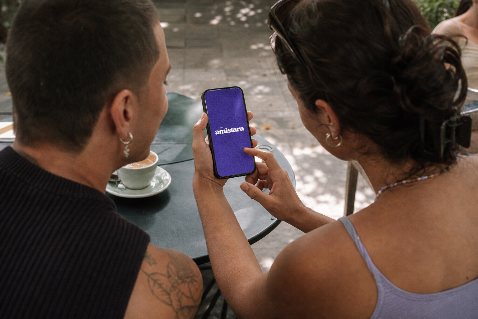 Two friends exploring The Amistara app together